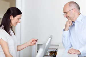 woman looking at an insurance card